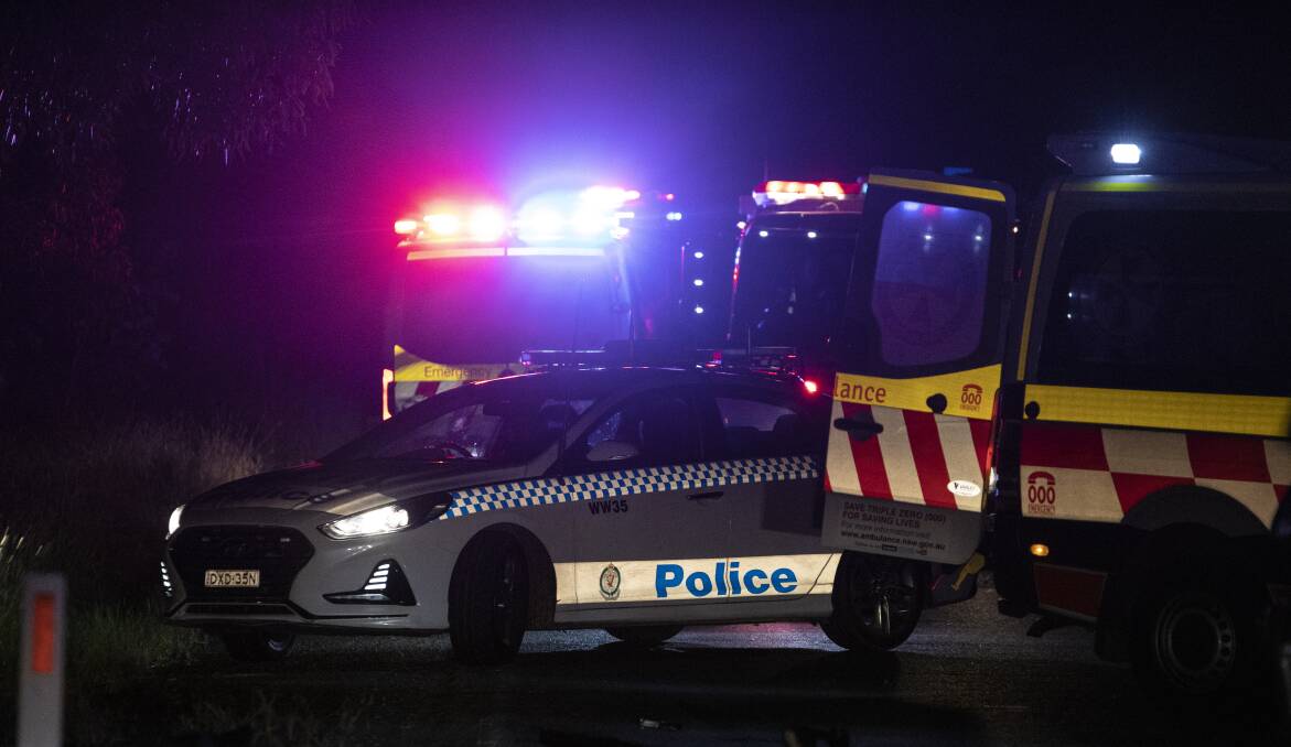 Emergency services crews at the scene of a fatal crash on Holbrook Road near Wagga on Saturday night. Picture: Ash Smith