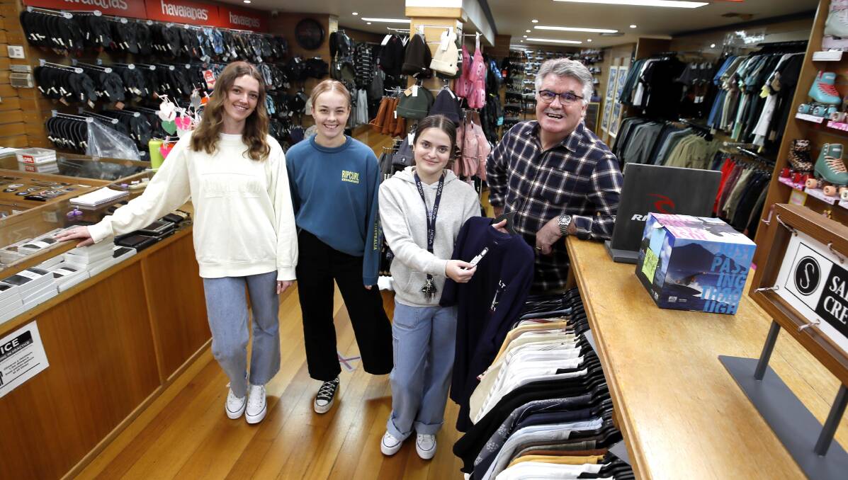 END OF AN ERA: Mark MacKenzie, of Mark Anthony's Clothing, with staff members Lara Rossiter, Shae Skelton and Jada Thorpe. Picture: Les Smith