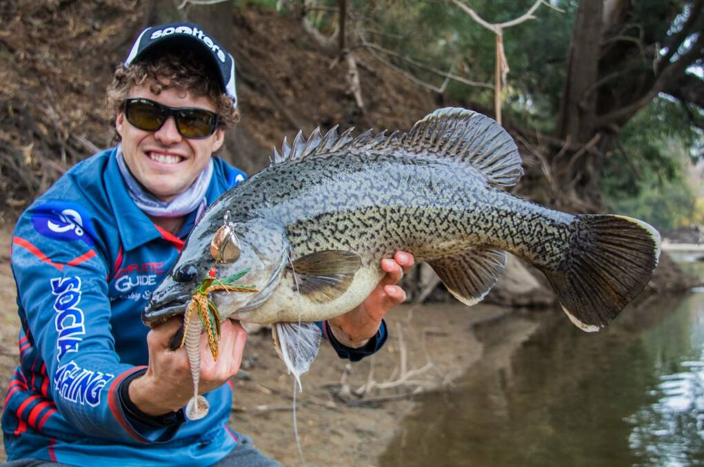HOOK, LINE AND SINKER: Social Fishing founder Rhys Creed proudly shows off his catch of the day - an impressive Murray Cod. Picture: Social Fishing