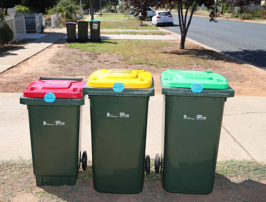 NEW LOOK: About 75,000 bins are being replaced across the city, as part of a push towards an environmentally-friendly waste system. Picture: Kieren L Tilly.
