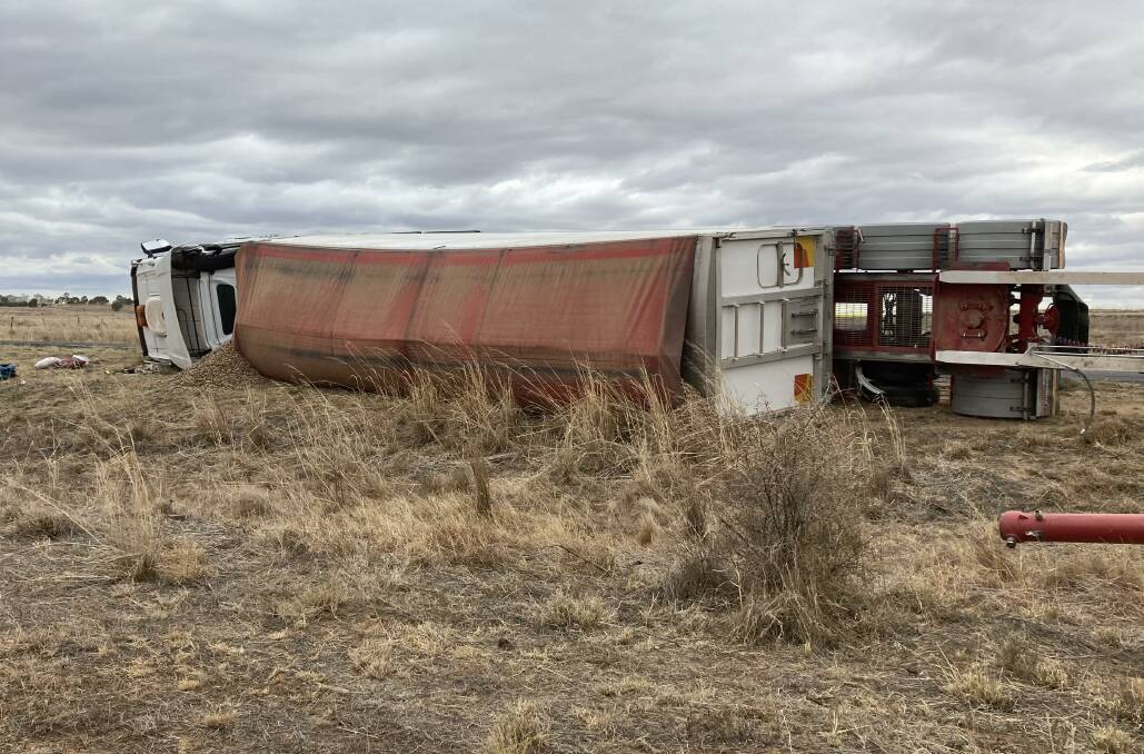 A truck driver escaped with minor injuries after rolling his nut-loaded rig on the Sturt Highway on Tuesday. Picture: Supplied