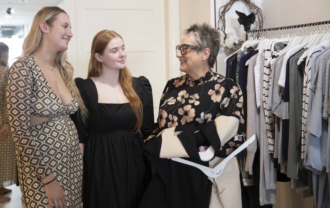 FASHIONISTAS: Ted & Olive Boutique owner Brenda Tritton (right) helps Milla Daly and Prue Duck select their outfits for Friday's Gold Cup. Picture: Madeline Begley