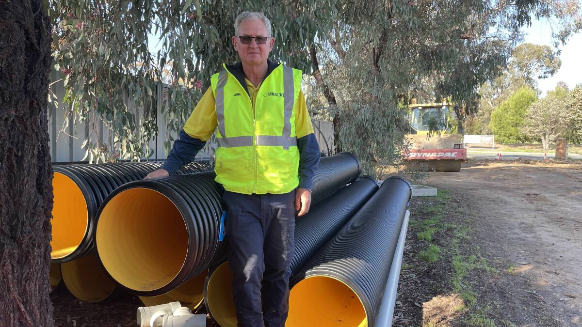 John Keough, of Turners Civil, with the synthetic pipes at the heart of the stoush with Wagga City Council. Picture by Conor Burke