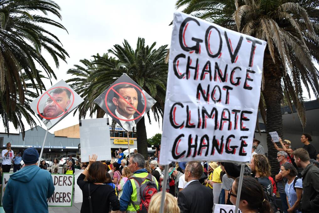 STRONG MESSAGE: Voters in Sydney protest the federal government's inaction on climate change during the election campaign. Picture: AAP Image/Joel Carrett