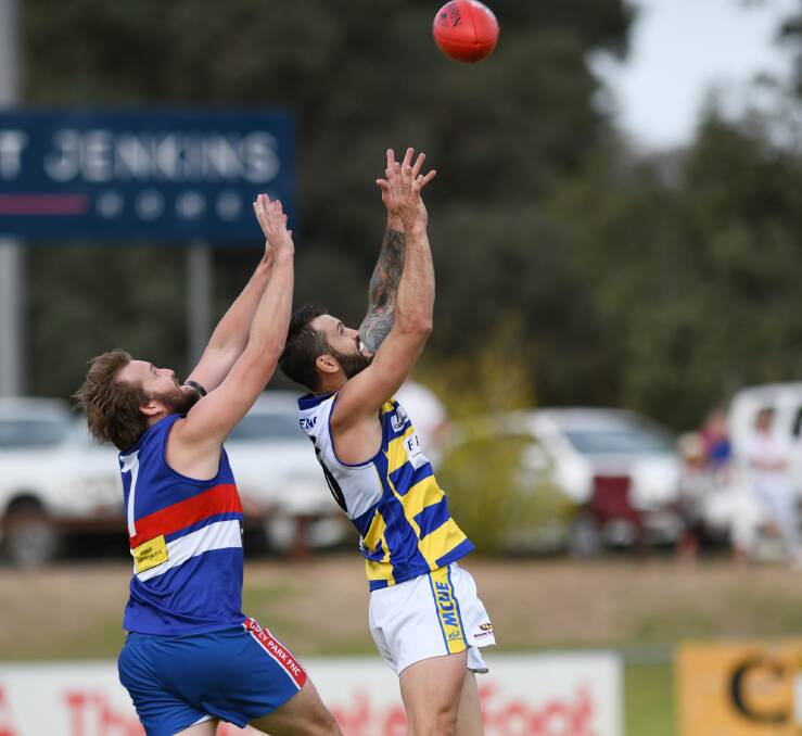 CHANGE OF SCENE: Goannas defender Tim Smith goes up for a mark in front of Turvey Park forward Clint Shields earlier this year.