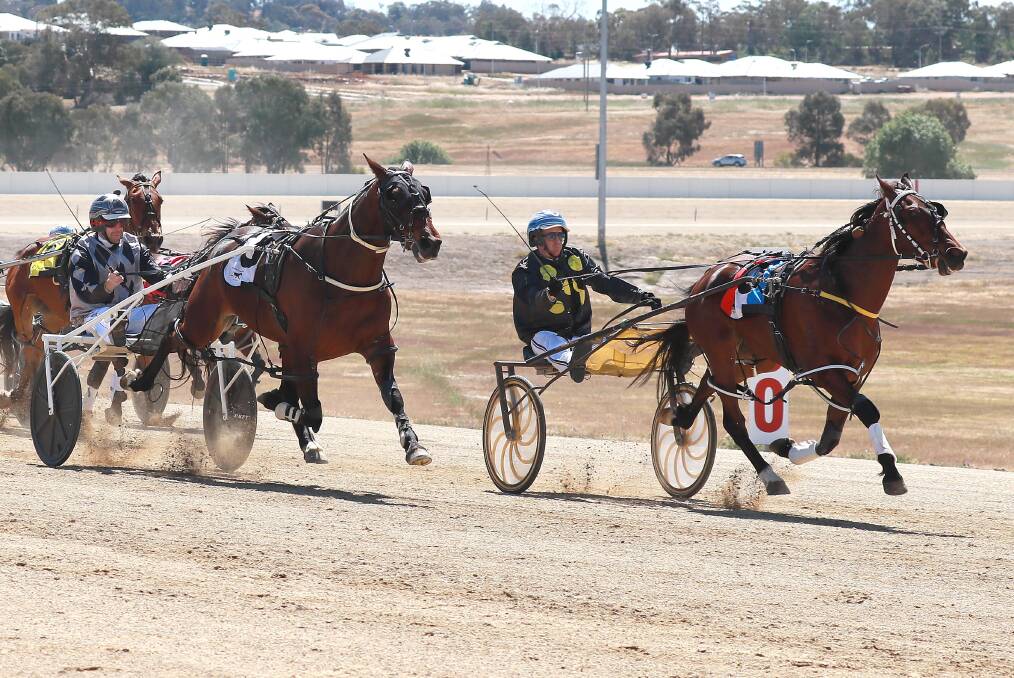 FLYING FINISH: Jared Kahlefeldt and Soho Beijing (left) launch their bid to run down the Blake Jones-driven Monterei Heaven in the last stride at Riverina Paceway. Soho Beijing was the first of two winners for the Kahlefeldt stable. Picture: Les Smith
