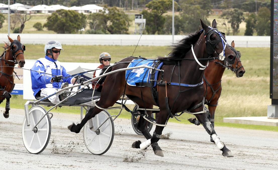 MERRY WAY: Thomas Gilligan steers Ona Merry Dance to a maiden win at Riverina Paceway on Friday, ahead of Brett Woodhouse's Esther Rising. Picture: Les Smith