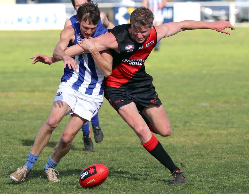 FIERCE COMPETITION: Marrar's Nic Cooper tussles with Temora skipper Rob Grant in 2019. Cooper is back for this year after moving away following 2019. 