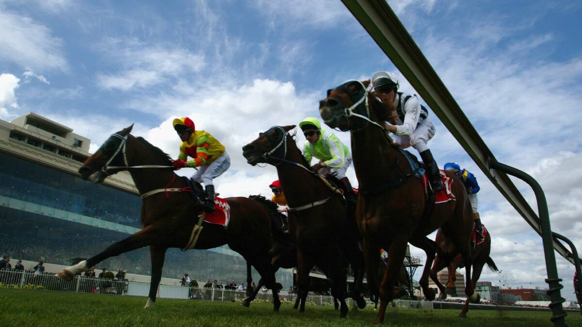 Jimmy Cassidy and Platinum Scissors (left) win the Norman Robinson at Caulfield in October 2002. Picture: Getty Images