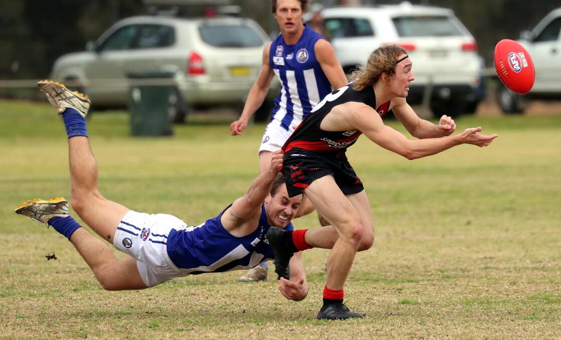 TOO SLICK: Temora defender Max Richardson can't stop Marrar forward Zach Walgers getting the ball out in their semi-final. Picture: Les Smith