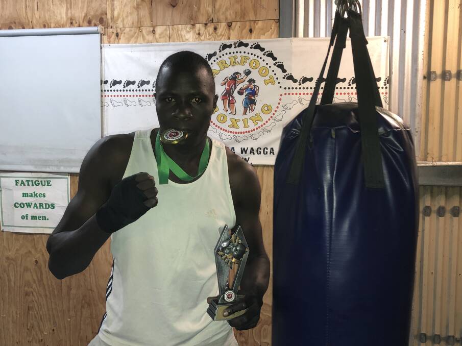 TASTE OF VICTORY: Wagga heavyweight Regarn Simbwa enjoyed a unanimous points win in his return to boxing at a Canberra fight night earlier this month. Picture: Peter Doherty