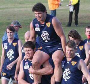 Shane Pound chaired off by brothers Carl and Tony after his 300th game, also against Marrar.