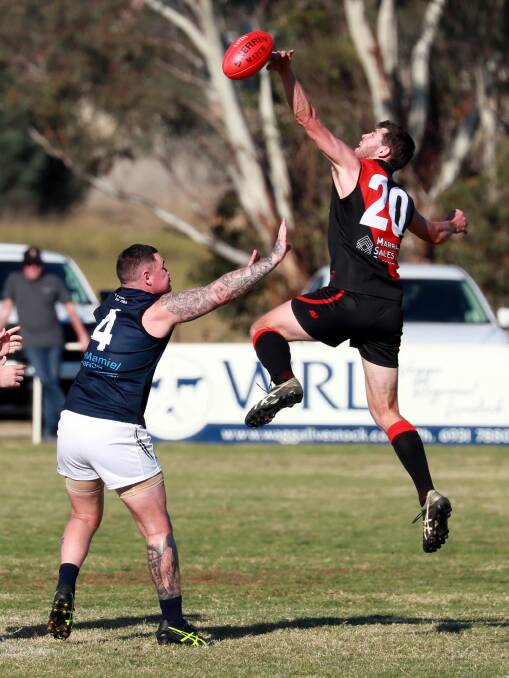 Marrar's Nick Molkentin gets up to try to prevent a Jade Hodge opportunity for Coleambally