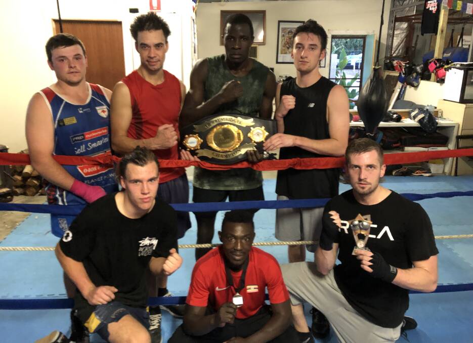 SHAPING UP: (back row, from left) Barefoot Boxing's Billy Kelly, Garth Scriber, Regarn Simbwa, Angus Heine; (front) Liam Parnell, Bashir Nasir and Adam Owers will all feature in Saturday's 21-fight card. Picture: Peter Doherty