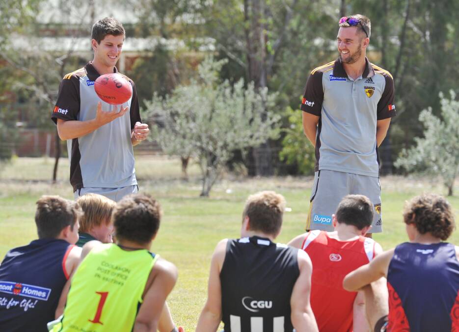 STAR SUPPORT: Matt Suckling (right) and Luke Breust at training session with The Riverina Anglican College Carroll Cup team in 2013. 