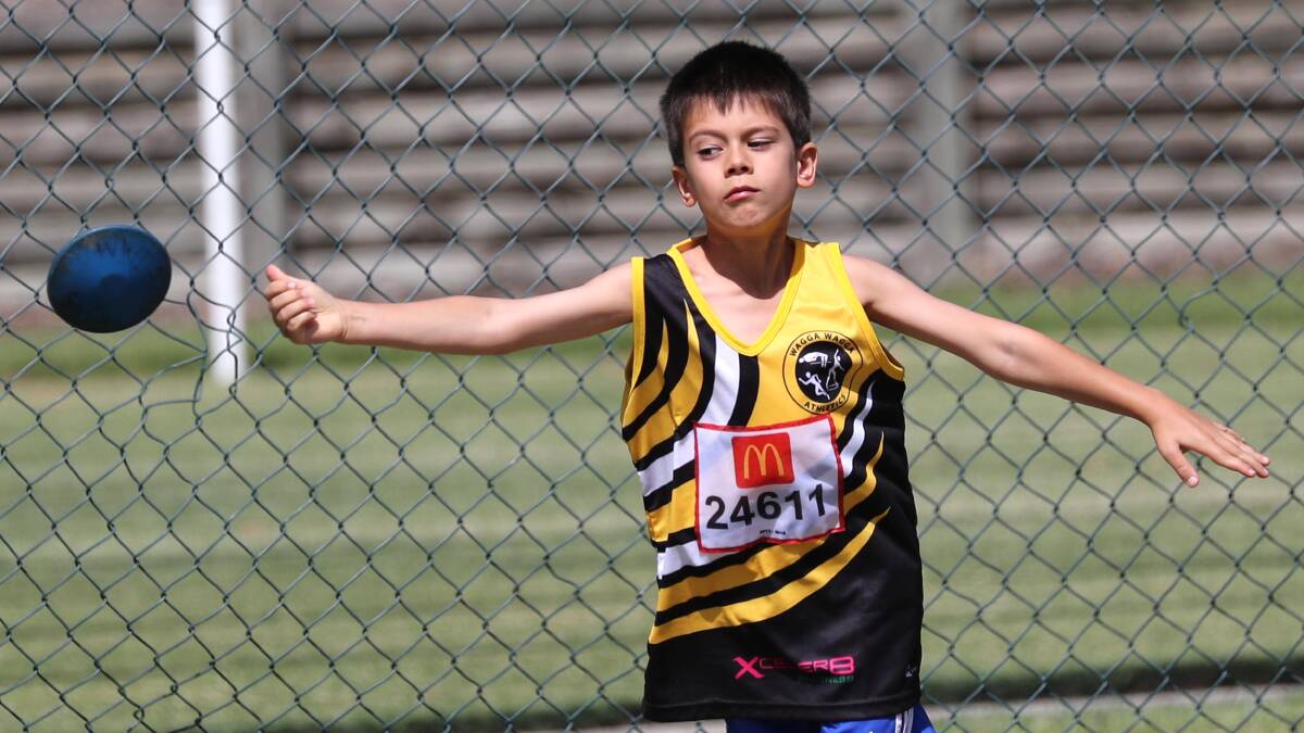 Max Donaldson lets fly with the discus in last year's annual Wagga Little Athletics Club carnival. Picture: Les Smith