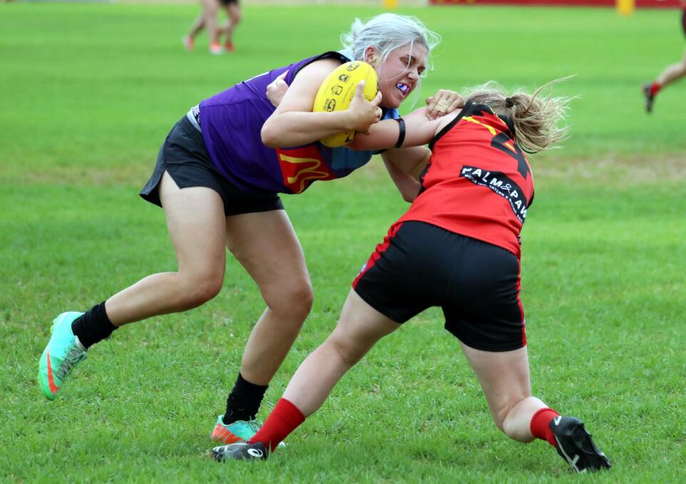Natalie Creed from Brookdale Bluebells powers into a Lions defender last season. Picture: Les Smith