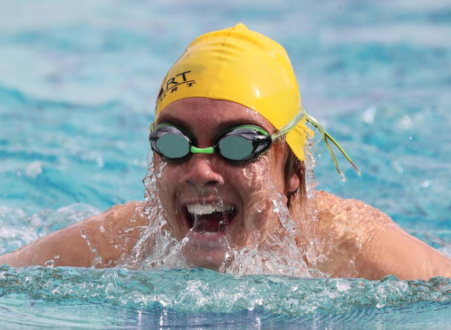 ALL SMILES: Kyle Hockley, 17, comes up for air in the 50m breastroke at the Mater Dei Catholic College swimming carnival on Thursday evening. Picture: Les Smith