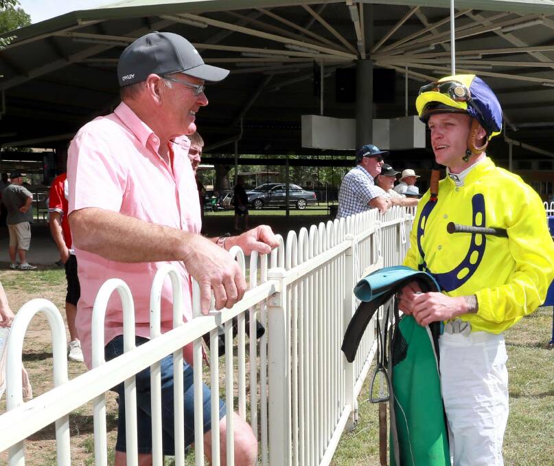 Wayne Carroll (left) with Blaike McDougall at Gundagai on New Year's Day. McDougall has seven rides in eight races at Albury on Friday but will be up against Carroll's Miss Elsie May (to be ridden by Nick Heywood), in the 1000m Maiden. Picture: Les Smith