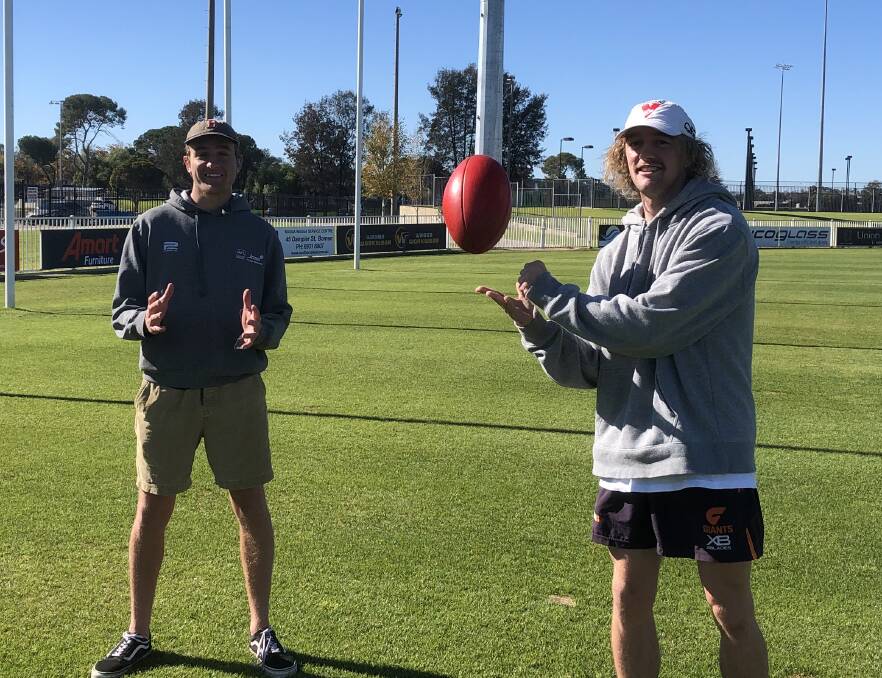 GRAND MEMORIES: Marrar's Jack Reynolds (left) and Zach Walgers at Robertson Oval, where they were both part of the Bombers' historic 2018 premiership.