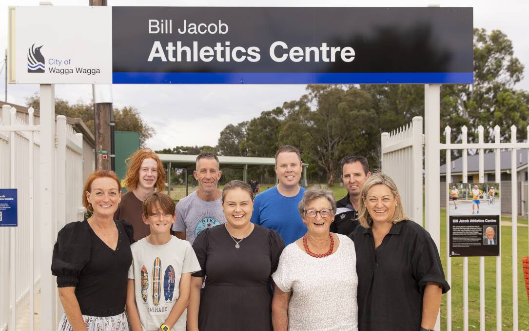 GATHERED IN HONOUR: Bill Jacob's daughter Ruth Murray (left) with sons Ben and Drew and husband Stuart are joined by Kooringal Athletics presidents Steve Cook and Mick Dare (back right), and Bill's granddaughter Anna Young, his wife Robin and daughter Sarah Young (front right). The facility at Jubilee Park is now formally the Bill Jacob Athletics Centre. Picture: Ash Smith