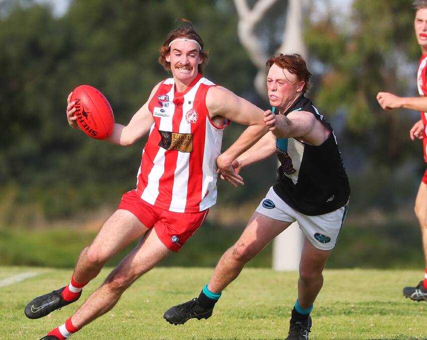 CHASING FINALS: Northern Jets' Hamish Gaynor tries to stop CSU's Connor Kelly. The Jets have highlighted the return game on Saturday week as critical to their season. Picture: Emma Hillier