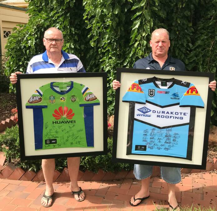 MEMORABILIA: Riverina Men of League president Kel Tilden (left) and secretary Steve Lawler with signed NRL jumpers donated in support of Len Gaffey fundraiser.