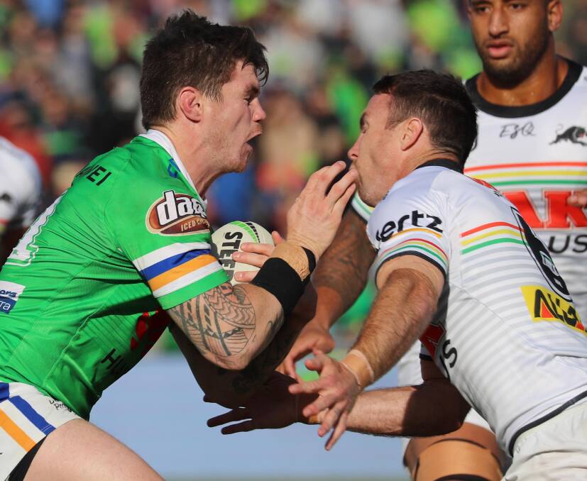 John Bateman and James Maloney head to head last year. Picture: Les Smith