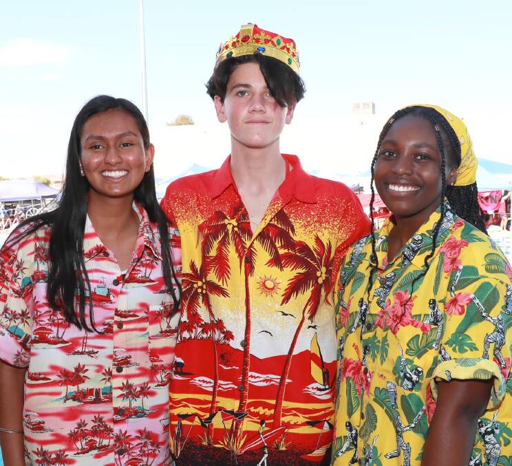 DRESSED TO IMPRESS: Stiya Martin, Mikey Lupca and Priddycia Jusu at the Kildare Catholic College swimming carnival on Thursday night. Picture: Les Smith