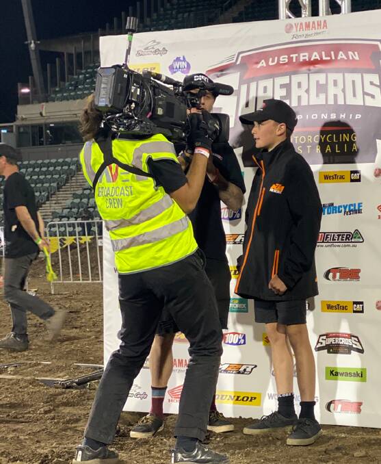 THE BIG TIME: Wagga's Byron Dennis is interviewed by the TV broadcaster after the presentations at Wollongong's round of the Australian Supercross Championships.