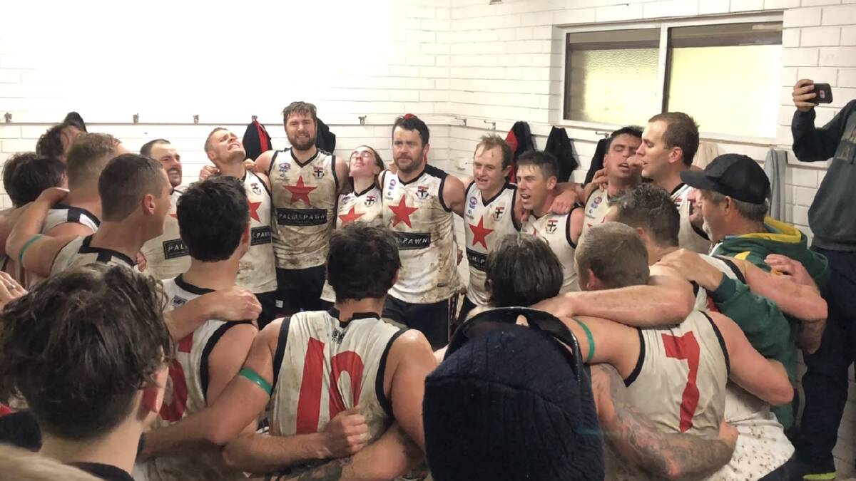 The Saints belt out the team song - joined by Andrew Hanlon - after their emotional victory against Marrar two weeks ago. Picture: Peter Doherty