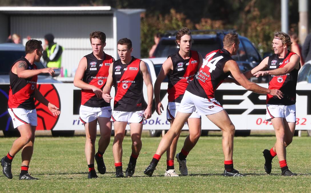 HAPPY DAYS: Marrar were on song at Gumly beating EWK by 31 points and stars James Lawton (44) and Zac Walgers (right) are among those celebrating.