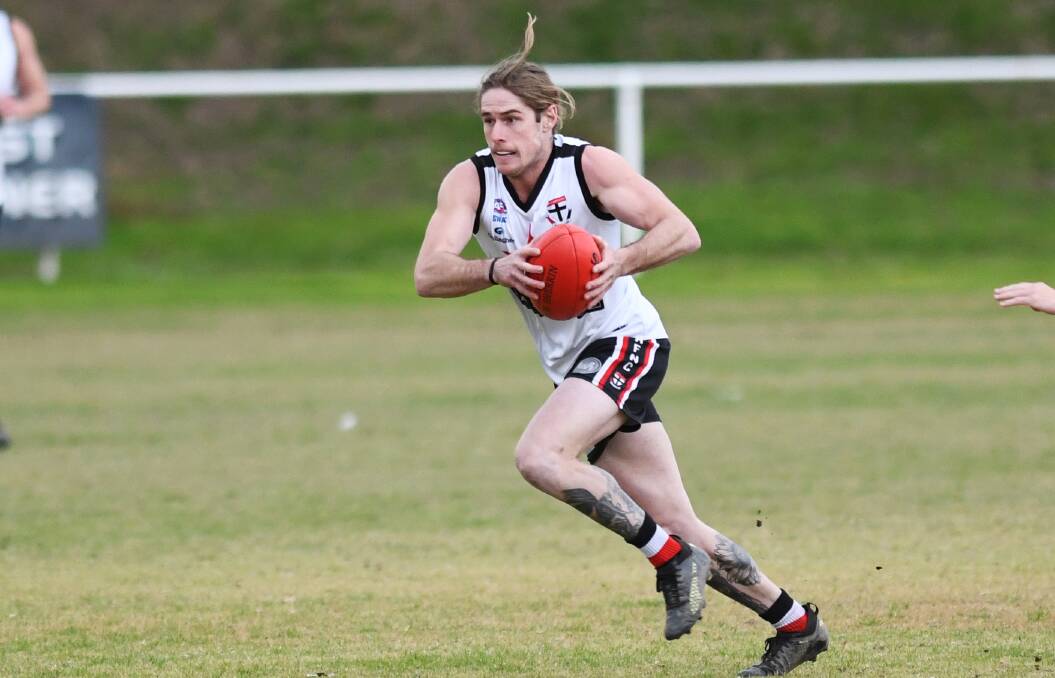 OUT: Corey Watt playing for the Saints against Marrar earlier in the year. He's out this week after pulling a hamstring last Saturday.