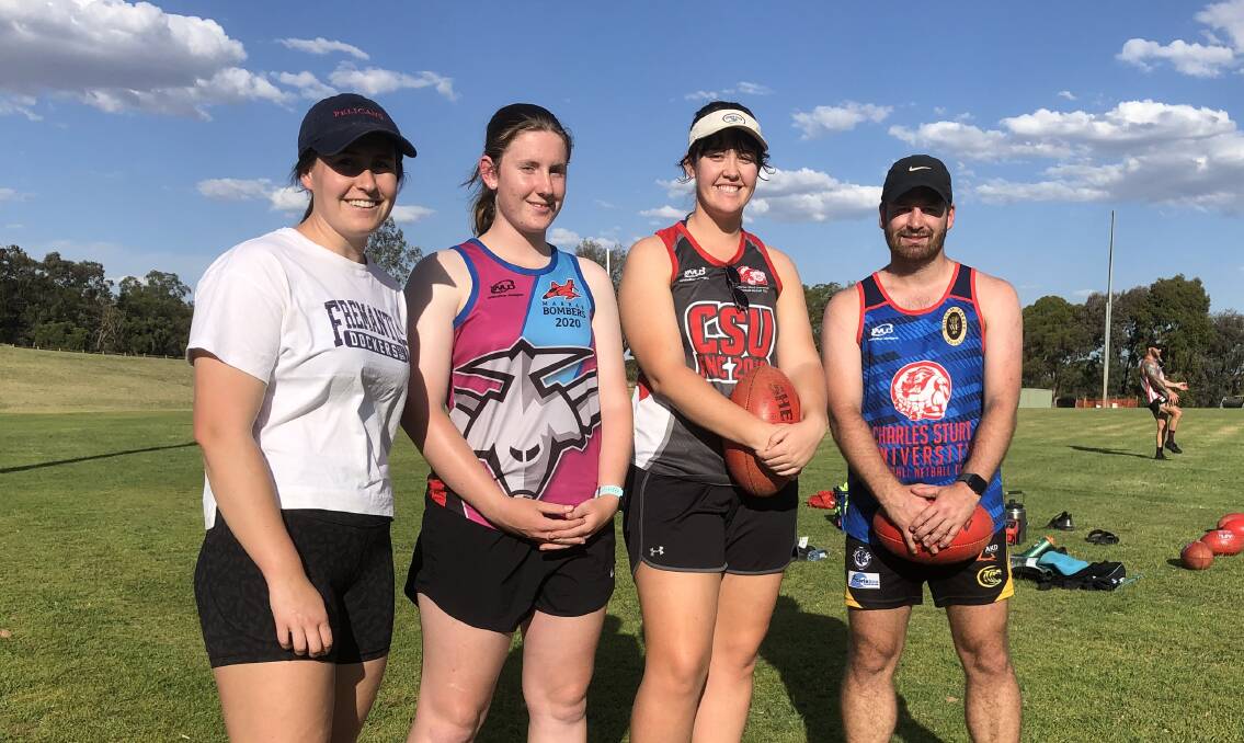 KEEN: CSU players Holly Judd (left), Lucy McKelvie-Hill and Kelsey Hanlon with new women's team coach Sam Barrow at training on Thursday. Picture: Peter Doherty