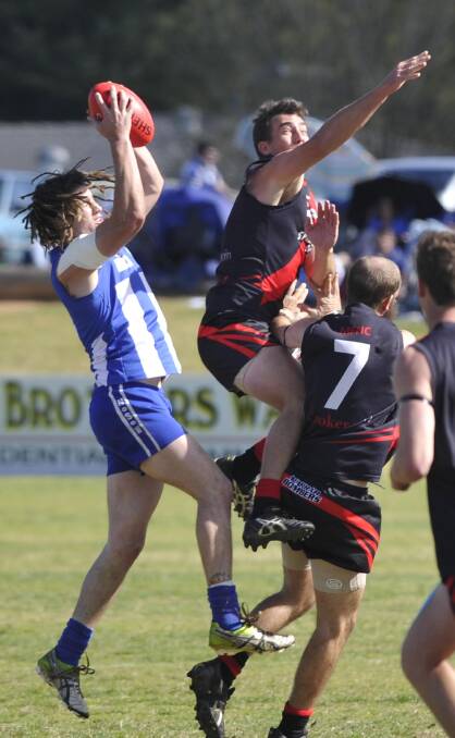 Tim McAuley (left) playing for Temora in the 2014 preliminary final - his last season in the blue-and-white. 