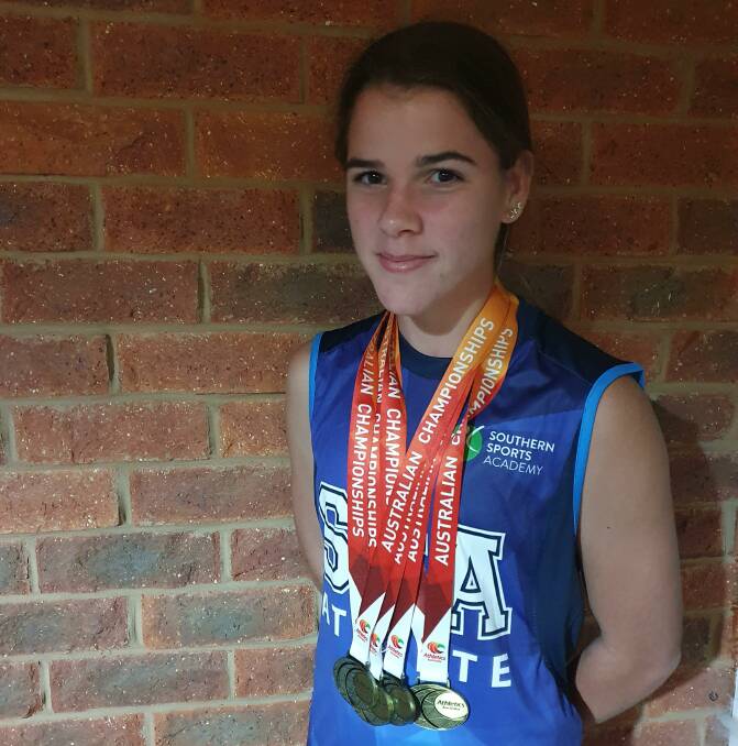 RECOGNITION: Indi Cooper with her swag of medals at nationals earlier this year. 