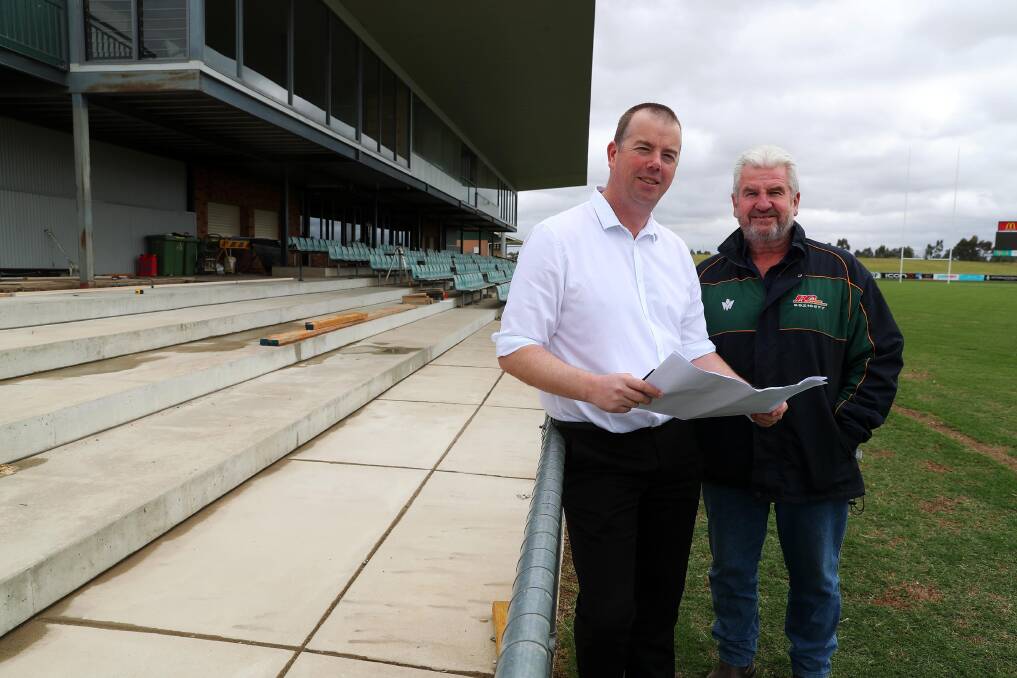 GOING TO PLAN: Wagga Council's Ben Creighton with WRL chairman Warren Barclay at Equex Centre on Friday. Concrete has been poured for the additional seating at the southern end of the grandstand. Picture: Emma Hillier