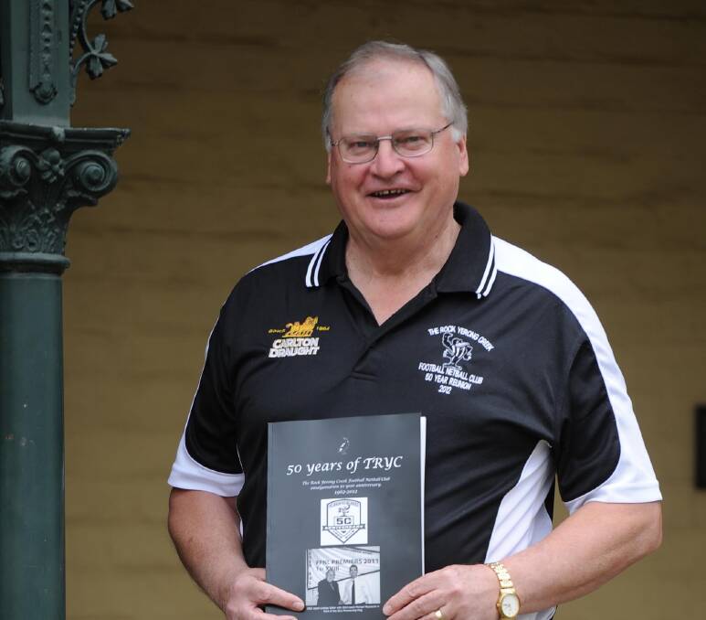 PASSIONATE ABOUT HISTORY: Greg Verdon in 2012 with a book he wrote on The Rock Yerong Creek. 