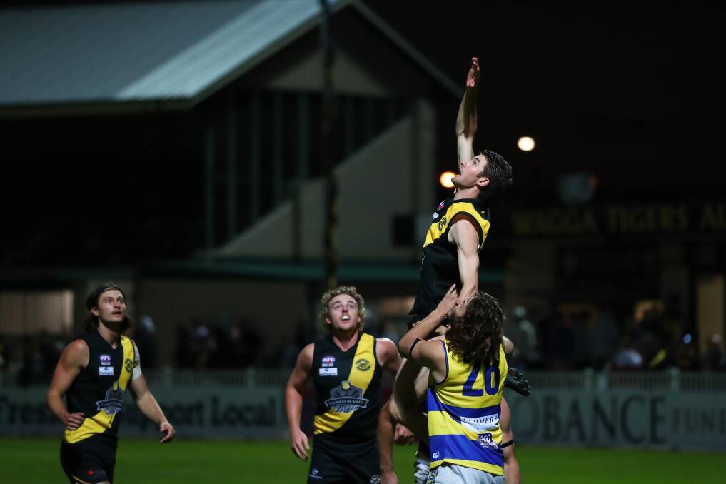 ELITE AMBITION: Wagga Tigers and Mangoplah-Cookardinia United-Eastlakes clash under lights last season. Both clubs want to be on the front foot in making sure they meet the criteria for the approaching 'Premier League' in 2023.