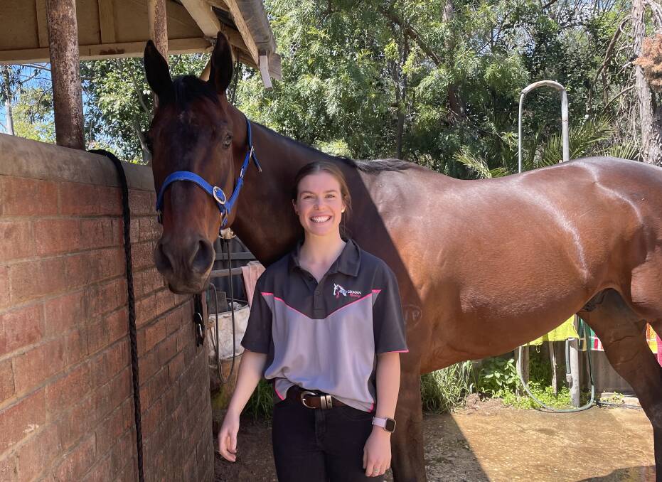 READY TO DEBUT: Strapper-turned-jockey Emily Waters with Cryfowl at the stables of Wagga trainer Scott Spackman. Picture: Peter Doherty