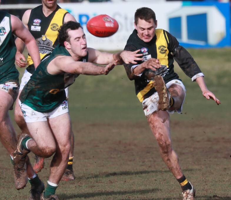 PREMIER COMP: Coolamon's Ryan Allen and Wagga Tigers' Nick Ryan in a Riverina League game at Kindra Park last season. Picture: Les Smith