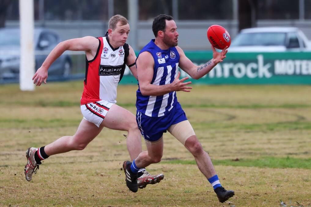 FINISHING UP: Temora coach Jake Wooden has the ball at his fingertips against North Wagga in 2019. Picture: Emma Hillier
