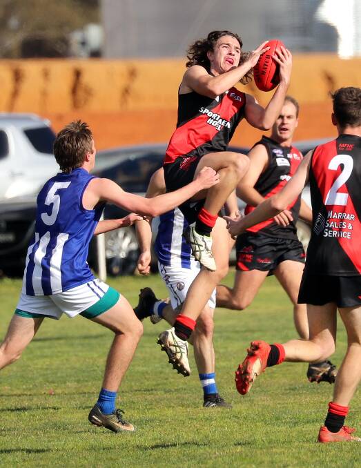 FLYING: Marrar's Drew Beavan takes a mark early in their win against Temora on Saturday. The teenager's composure and skill was on display in a fine game. Picture: Les Smith