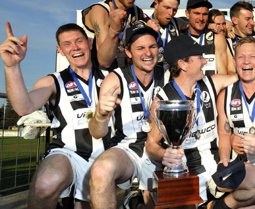 HAPPY DAYS: Aiden Ridley (front left) celebrates The Rock-Yerong Creek's 2015 grand final victory with his teammates. Ridley was assistant coach that season. Picture: Les Smith