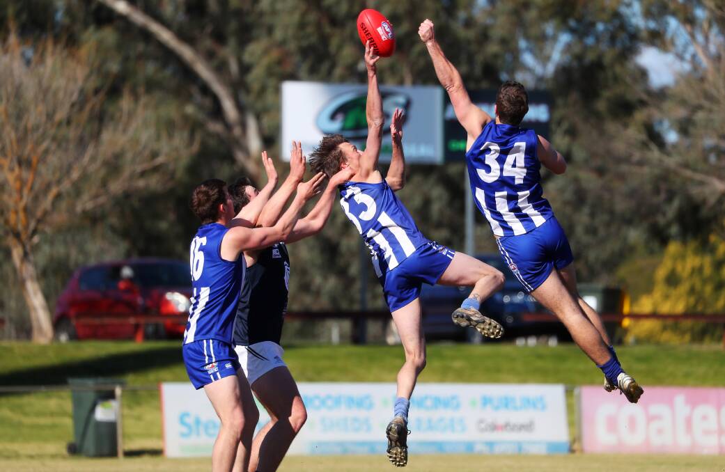 CHANGES: In this 2019 final, Temora had Angus McRae (left), Rob Grant (33) and Max Richardson (34) surrounding Colemabally's Jack Cullen. Cullen has since joined the 'Roos but is among their injured, along with Grant. Richardson is gone and McRae's holding the fort.