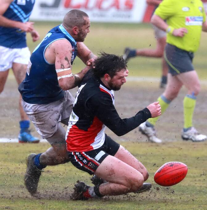 Lawder competes with Saints forward Daniel Jordan. Both are ending their seasons on the sidelines. Picture: Les Smith