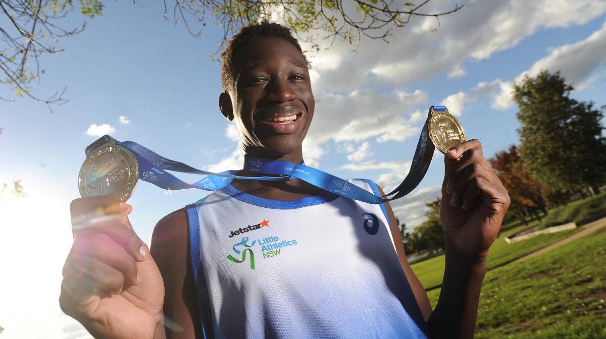 Godfrey Okerenyang with his medals after a national athletics carnival last year. Picture: Laura Hardwick