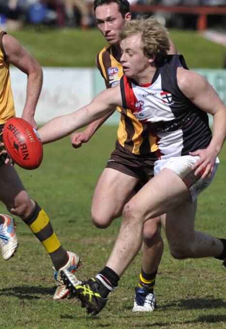 UNDER PRESSURE: North Wagga's Sam Longmore tries to drag the ball in against East Wagga-Kooringal at Maher Oval on Saturday. Picture: Les Smith