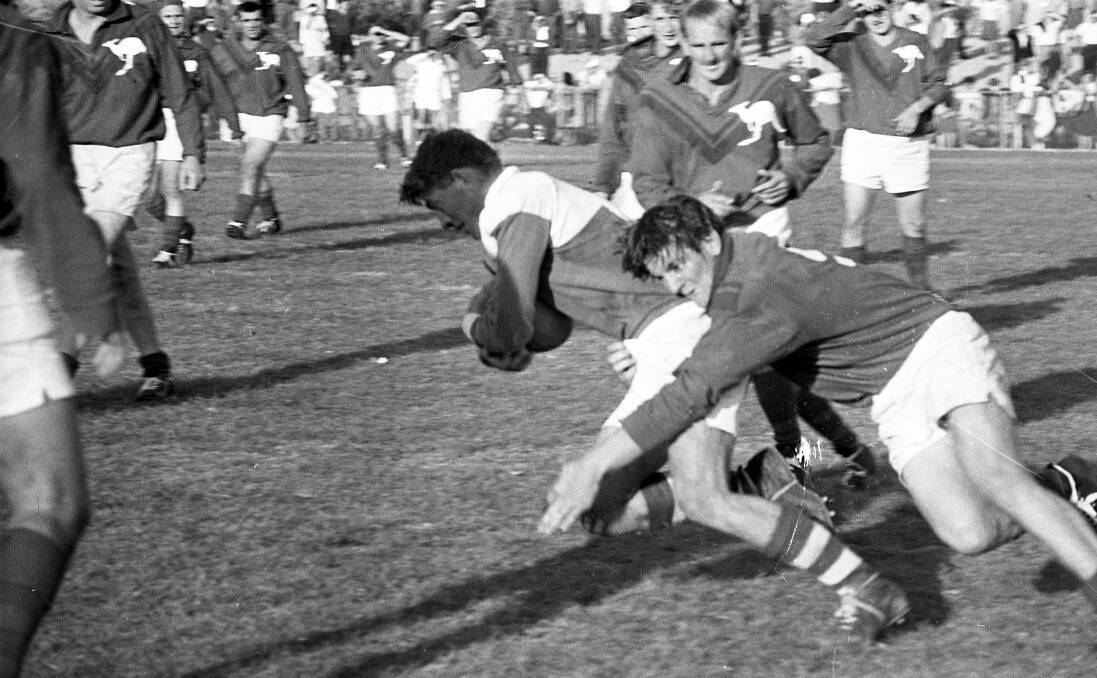 Gaffey makes a tackle for 'Roos in 1965. 
