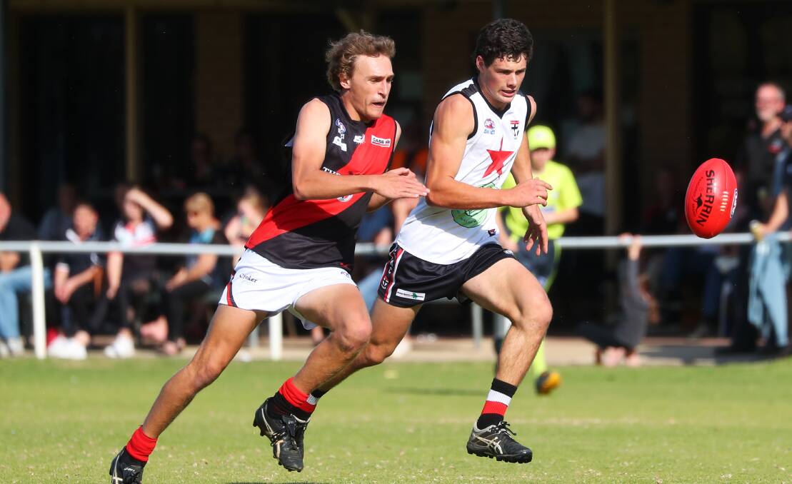 Jack Reynolds battles with Elliott Winter in Marrar's loss at North Wagga earlier this year.